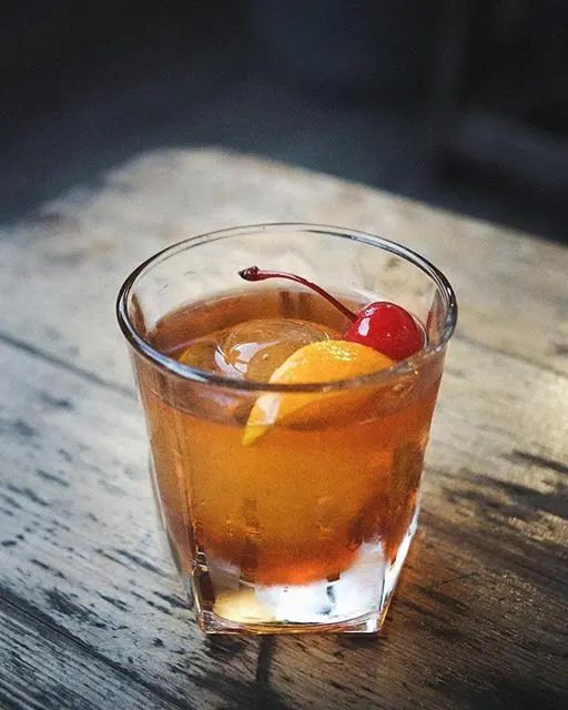 old fashioned with cherries and orange old fashioned with cherries and orange